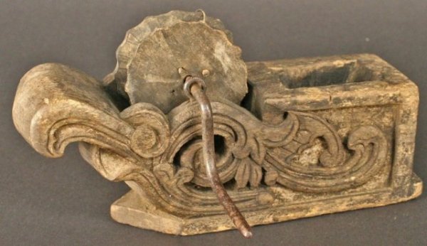 Korean Carpenter's Ink Line with Arabesque Design: Antique, ornately-carved carpenter's ink line (Meoktong) featuring an Arabesque design with the edges of the wheels themselves scalloped into a floral shape, wood, Korea, ca. pre-1900. Dimensions: 4-1