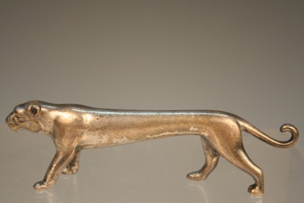 German Nouveau-Style Leopard Metal Knife Rest: Rare knife rest in the shape of a leopard in the art nouveau style, metal, early 1900s, Germany; marked with H WMF mark, standing for the German metalware makers Wurttembergische. Dimensions: 3-7/8"L 