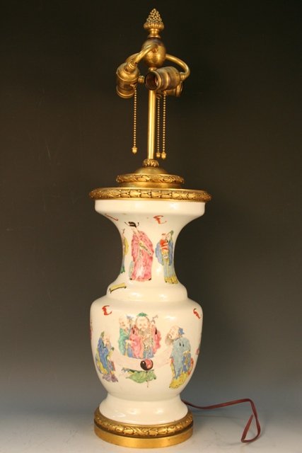 Qing-Era Chinese Vase Mounted as Table Lamp: Qing-era Chinese porcelain vase decorated with hand-painted figures, bats and butterflies, mounted as a three-socket table lamp on a bronze base by Edward F. Caldwell Co., New York; no mark visible on
