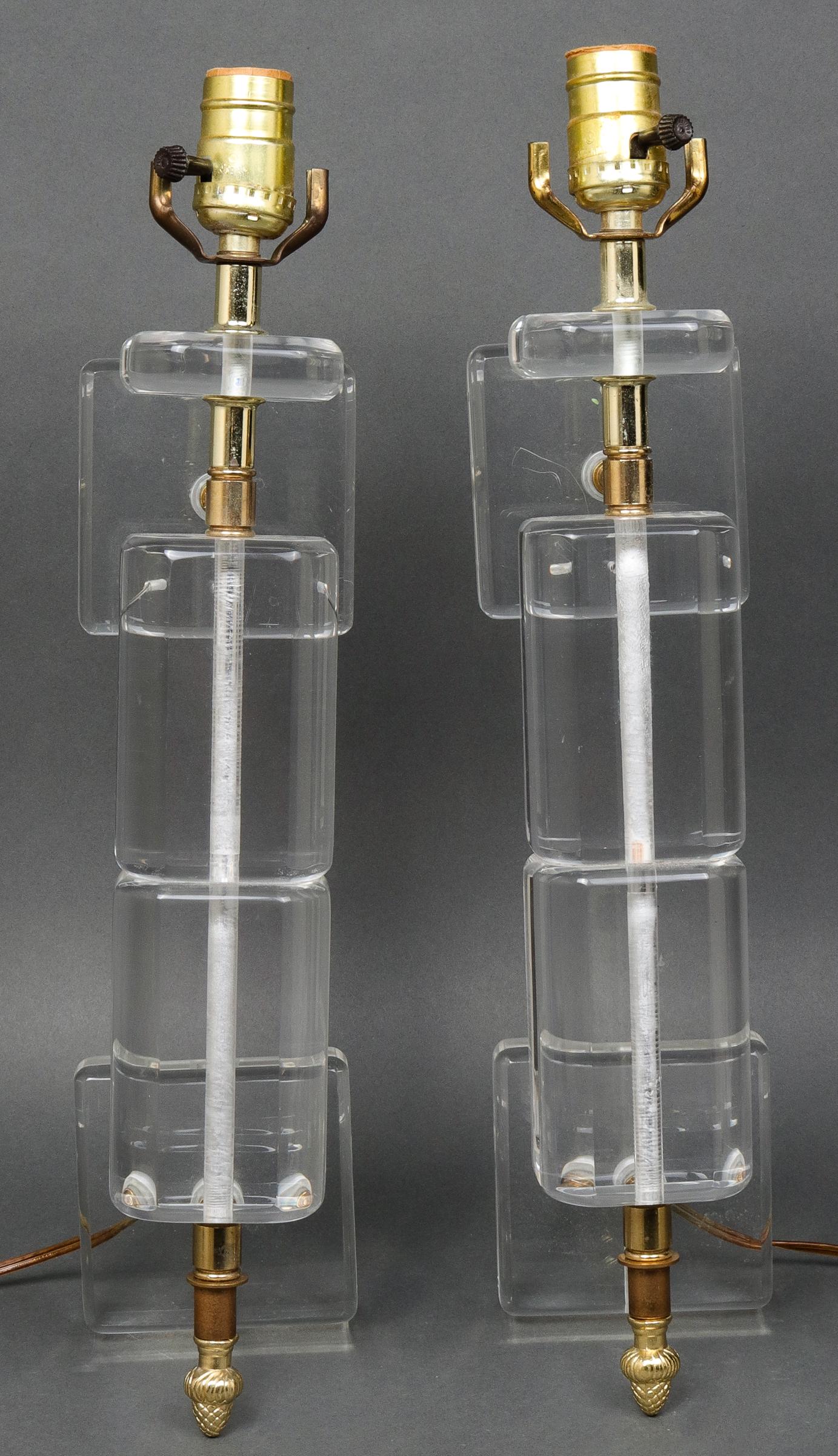 Mid-Century Modern Lucite Wall Sconces, Pair: Pair of mid-century modern / Hollywood Regency acrylic and lucite wall sconces. 14.5" H x 4" W x 4.75" D.