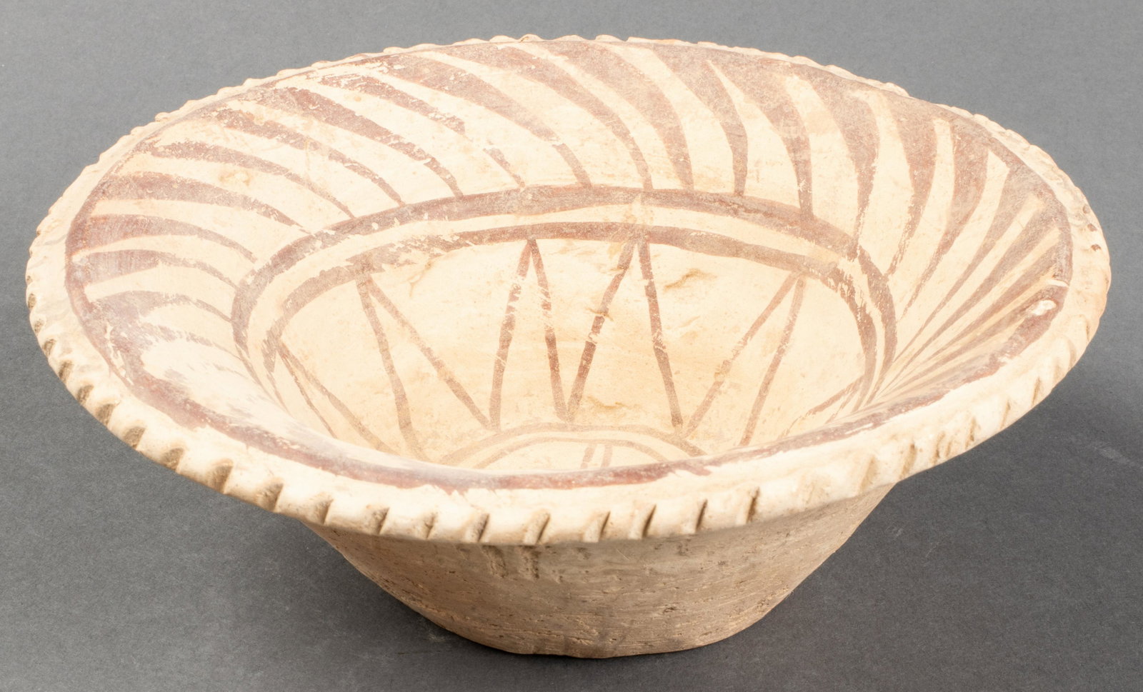 Chinese Neolithic Period Pottery Bowl: Chinese Neolithic Period (3000 BCE - 2000 BCE) pottery bowl, earthenware with painted decoration. 2.25" H x 6.25" diameter. Provenance: From the estate of art historian, Philip Gould.