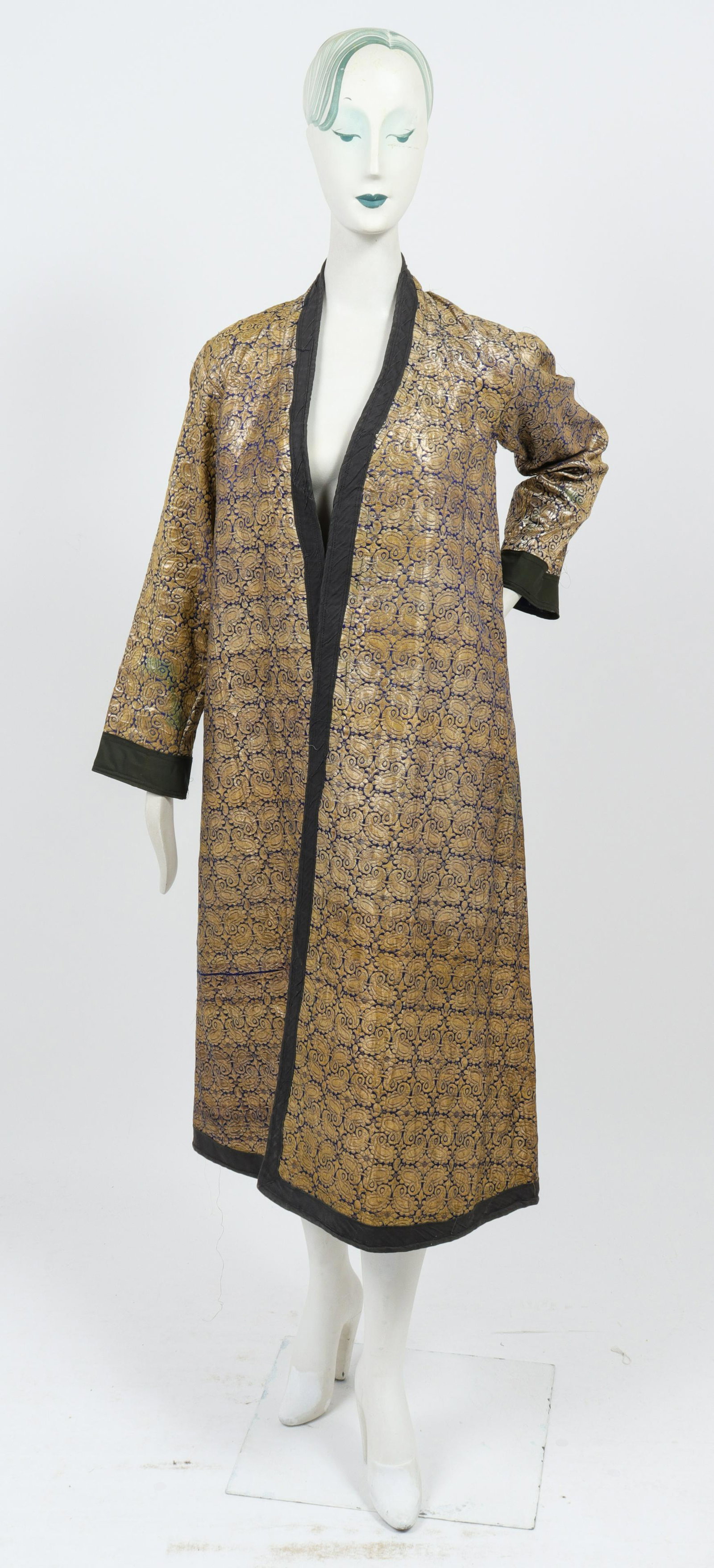 Metallic Gold Thread Paisley Brocade Sherwani: Indian textile: metallic gold threaded paisley brocade sherwani jacket caftan robe. Shoulders: 15.5" W; length to bottom hem: 64" L. Loose threading throughout. Property from the Estate of designer, m