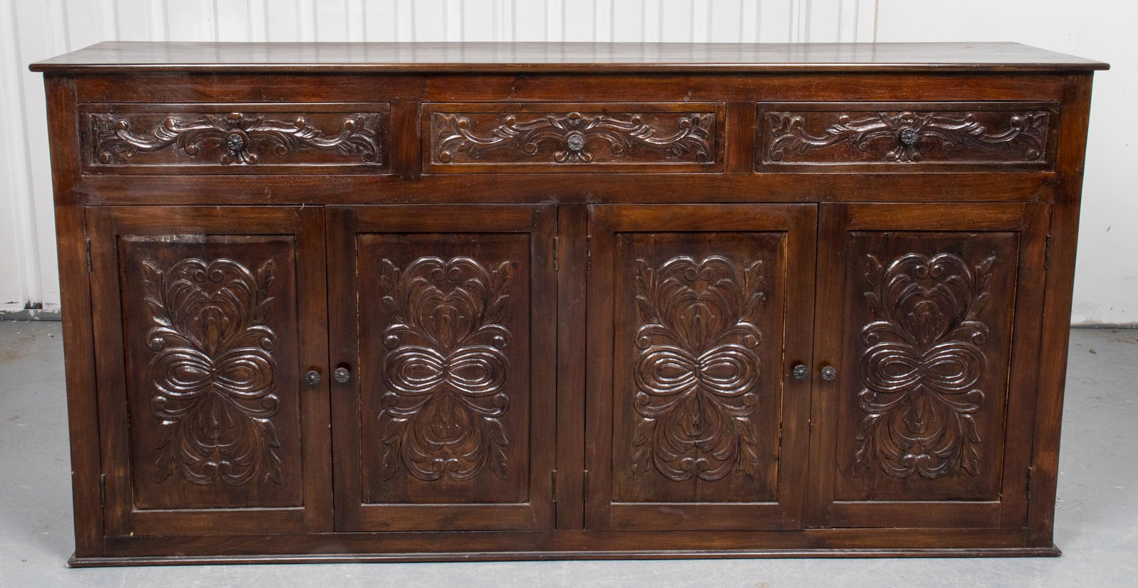 Renaissance Style Carved Oak Credenza: Renaissance style carved oak credenza, the cabinet with carved details to the three drawers and four doors. 40” H x 80” W x 19” D