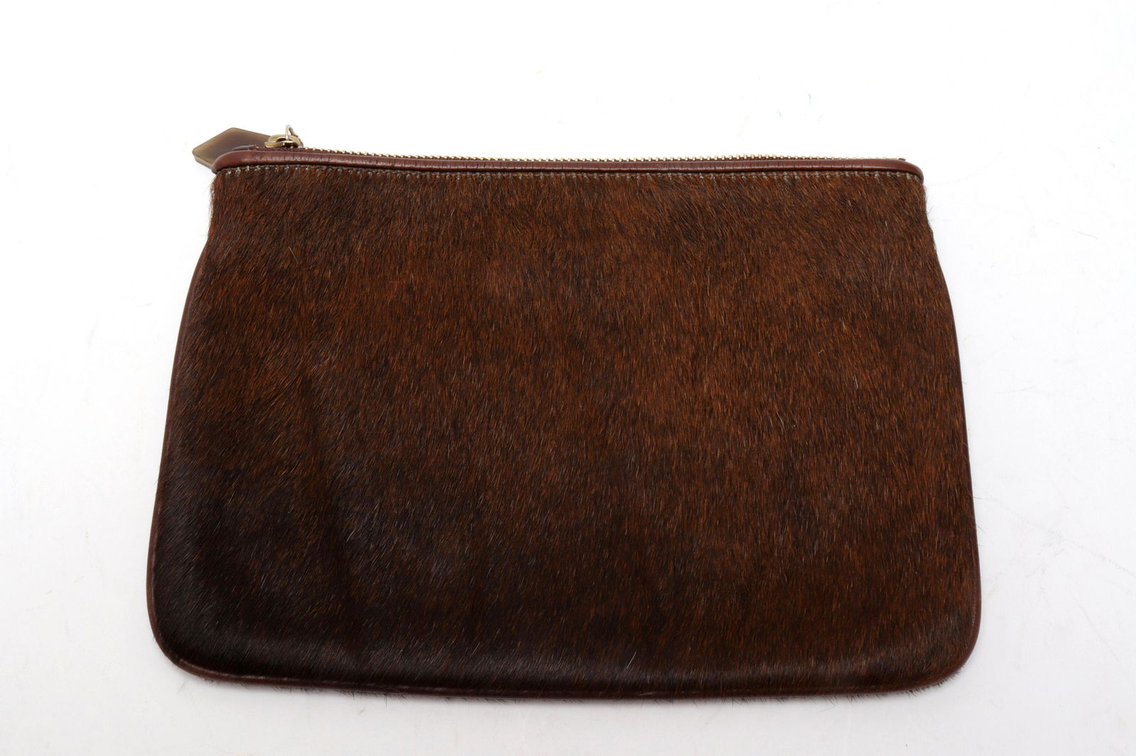 Nina Griscom for Gigi Haircalf Clutch: Nina Griscom for Gigi haircalf clutch, zipper closure, interior with maker's label: "Gigi New York." 7.5" H x 10" W x 0.5" D. Property from the Estate of designer, model, television host, and business