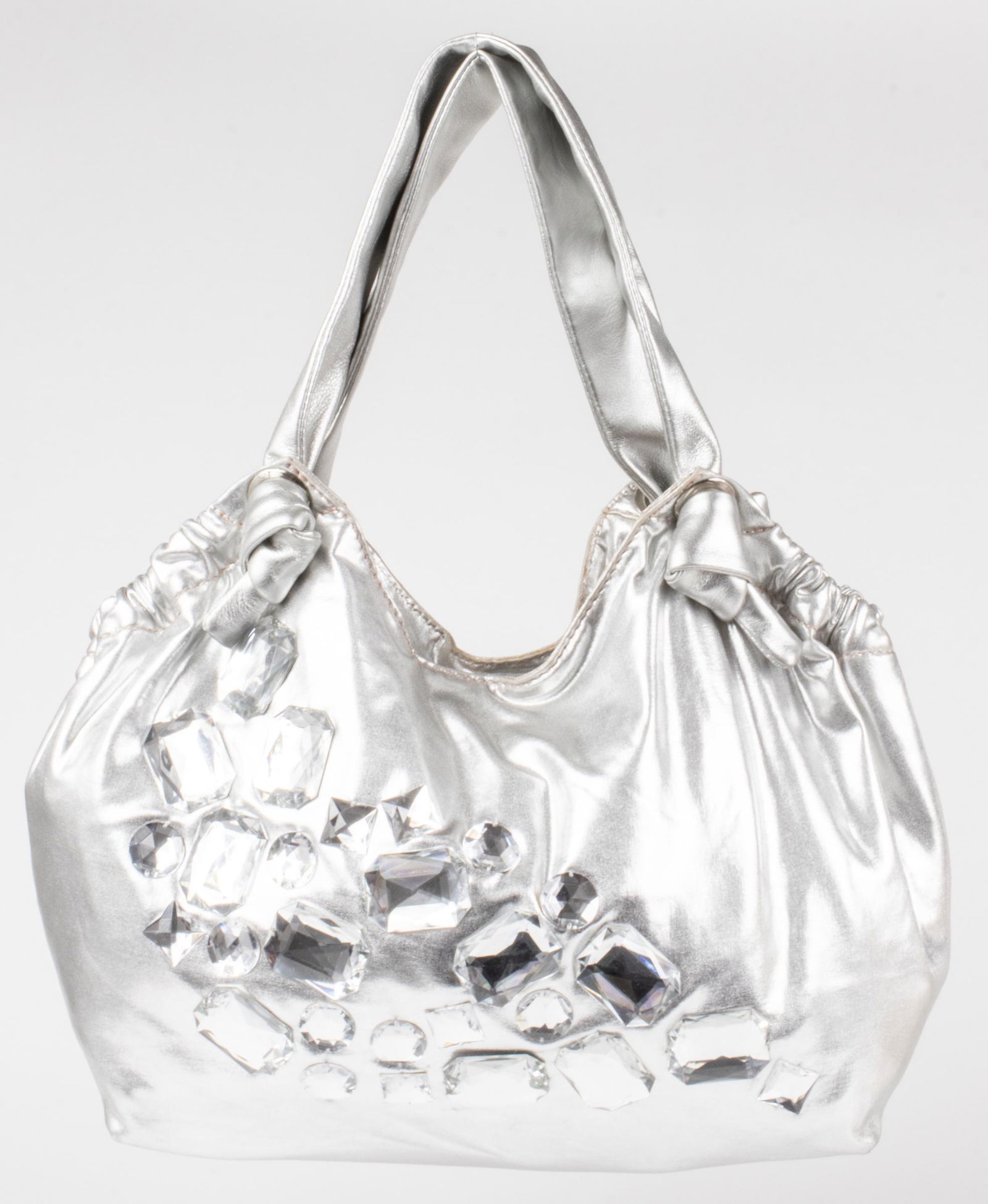 Stuart Weitzman Embellished Handbags, 2: Stuart Weitzman handbag, the first of hobo form, in silver-tone fabric with large crystal details, the interior with three pockets. The second of bucket form, in black leather with fringe detail aroun