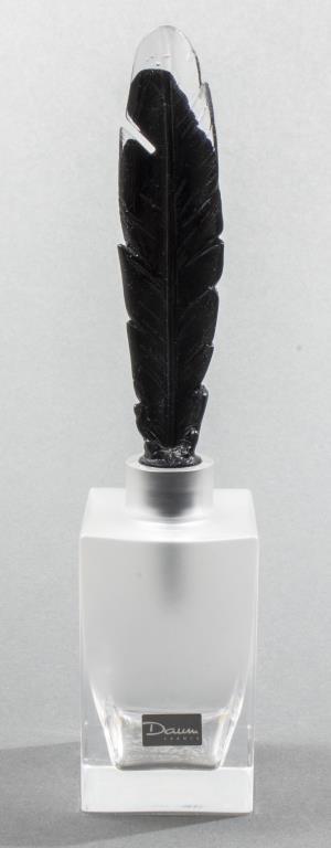 Daum "Flacon Cheyene" Art Glass Perfume Bottle: Daum "Flacon Cheyene" art glass perfume bottle with black and clear feather form stopper over frosted square base, signed: "Daum France." 8.75" H x 1.875" square.