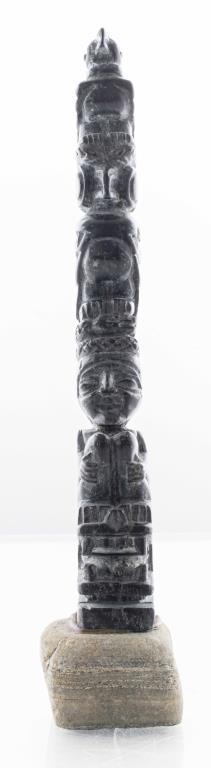 Northwest Coast Carved Soapstone Totem Pole: Pacific Northwest Coast carved soapstone totem depicting a stack of figures and creatures. Overall 11" H, totem 9.5" H