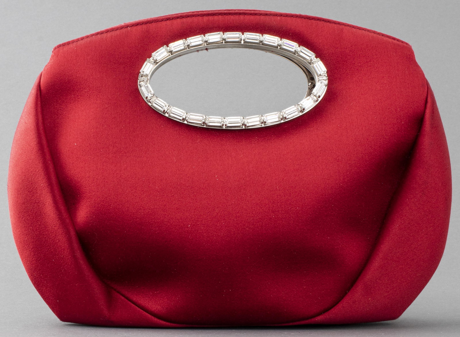 Oscar De La Renta Satin And Crystal Handbag: Oscar De La Renta red satin handbag with crystal details and two handles, the interior with single pocket and stamped "Oscar De La Renta". 9.5” H x 10.5” W x 3” D