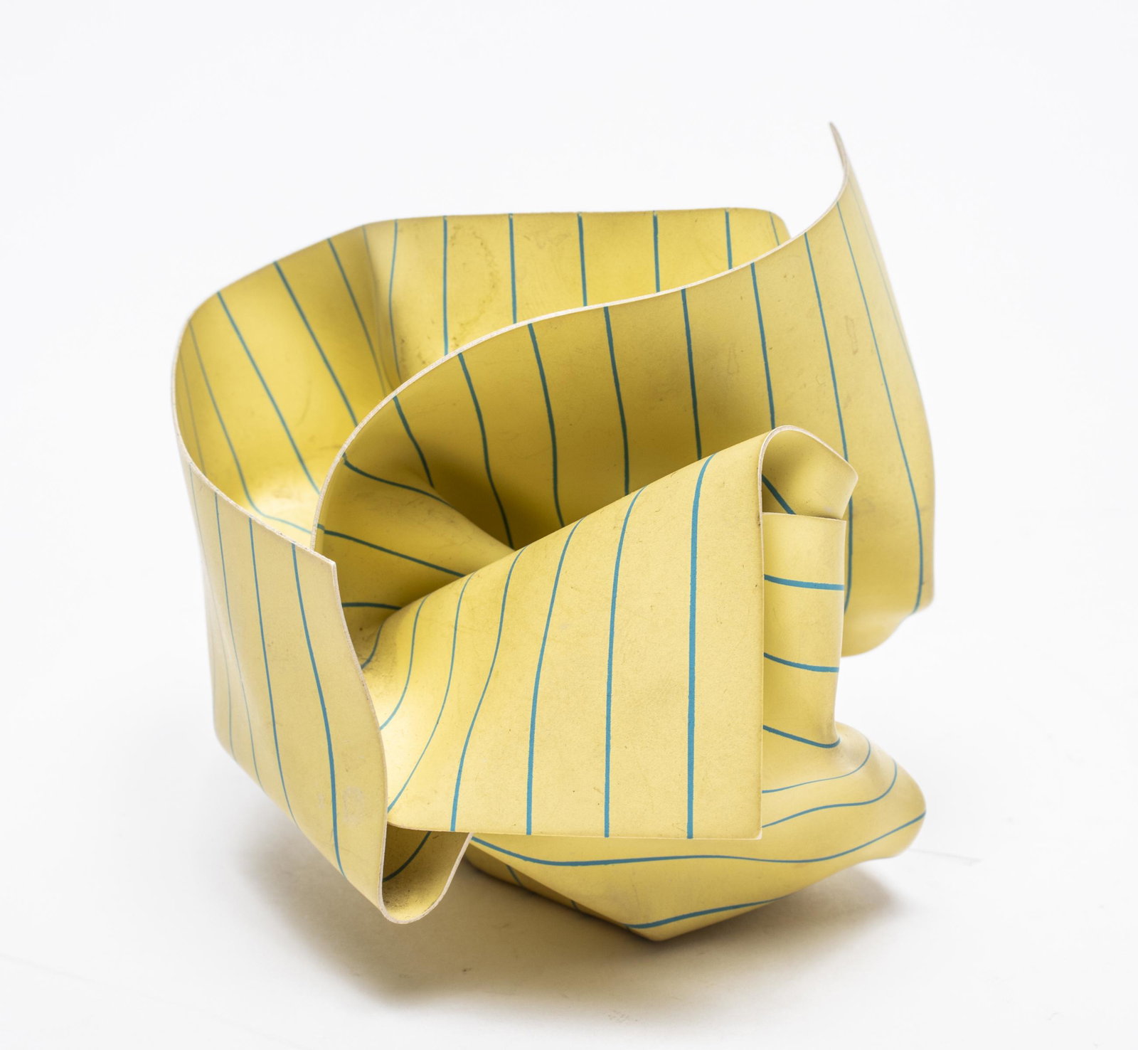 M&Co. Labs 1984-85 "Legal Paper" Paperweight: Contemporary design "legal paper" paperweight by Tibor Kalman and M&Co. Labs, made from rigid vinyl replicating a hand-crumbled piece of legal paper and wrapped around a steel weight. 3.5" H x 3.5" di