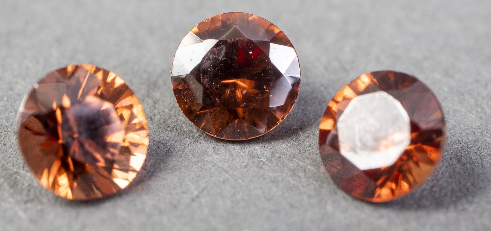 1.90 Cttw. Loose Round Cut Imperial Zircon Stones: 1.90 Cttw. collection of three loose round faceted-cut 5 mm imperial zircon stones.