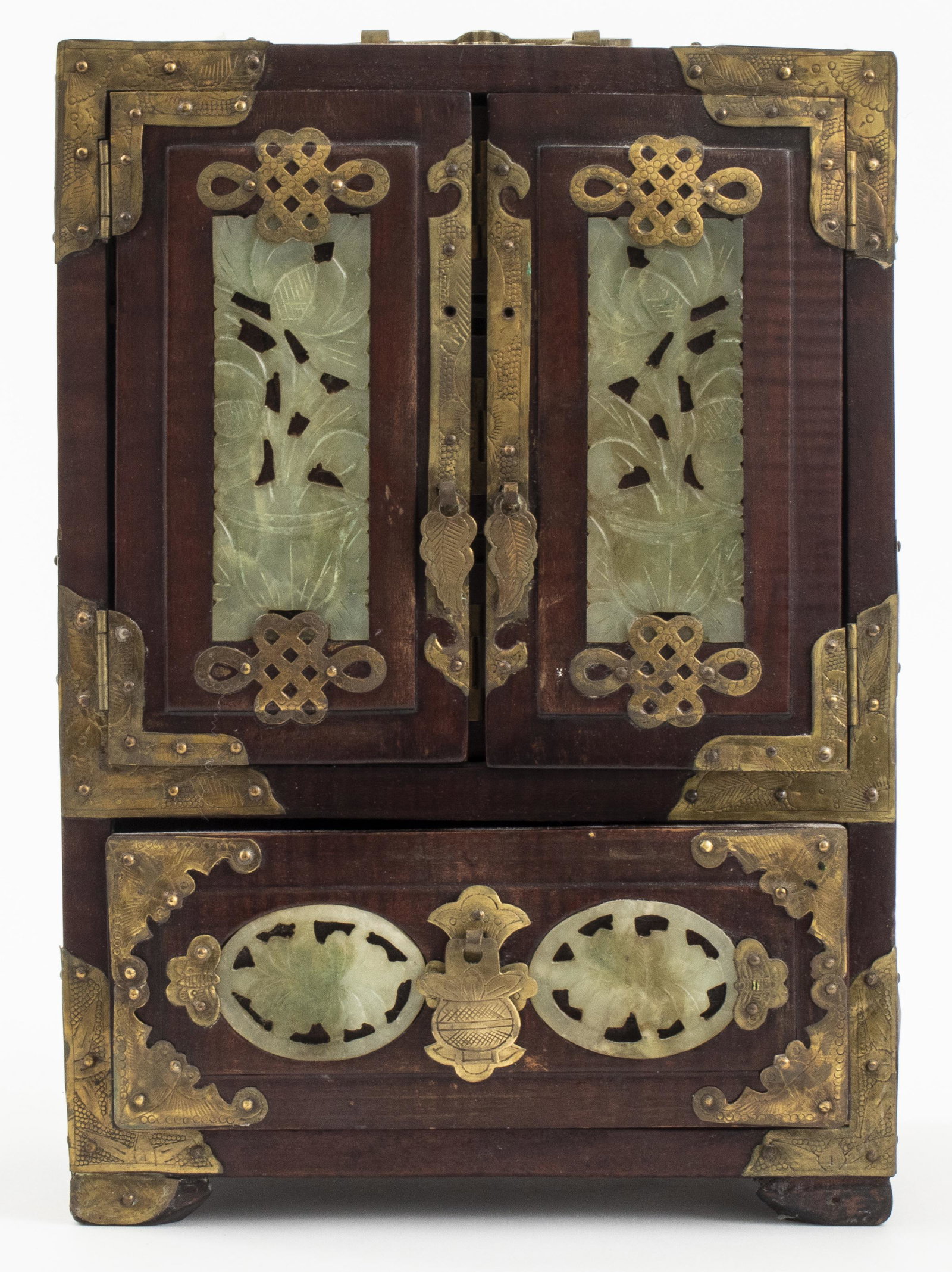 Chinese Carved Jade And Brass Jewelry Cabinet: Chinese carved jade and brass over wood jewelry cabinet, the double door top opening to three drawers, over single bottom drawer. 10" H x 7" W x 4.75" D.