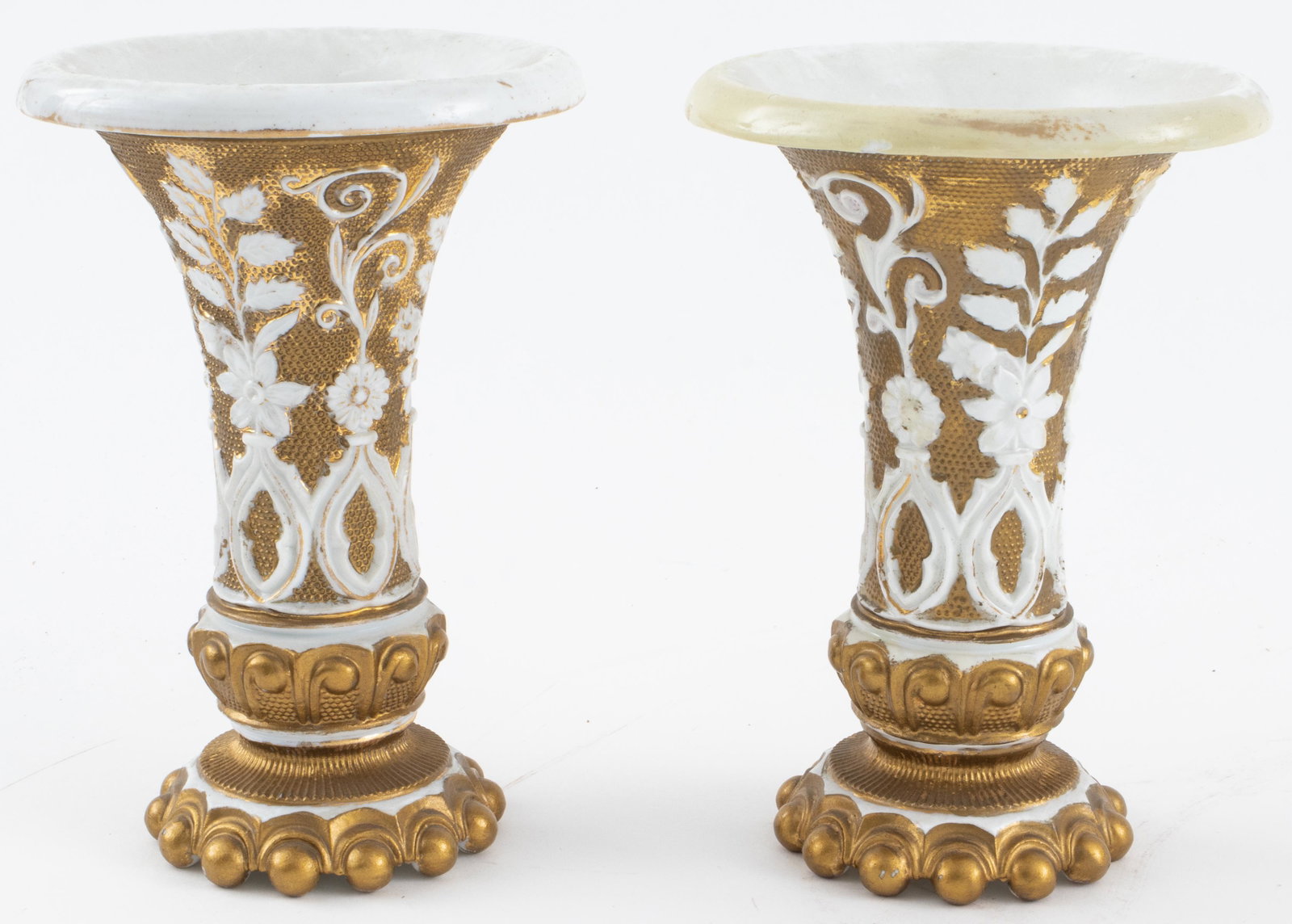 Meissen Parcel Gilt Porcelain Vases, Pair: Small pair of Meissen parcel gilt porcelain vases with foliate motifs, bases with blue underglazed marks and green marks. 6” H x 4.5” diameter. Provenance: Removed from a 157 East 57th Str