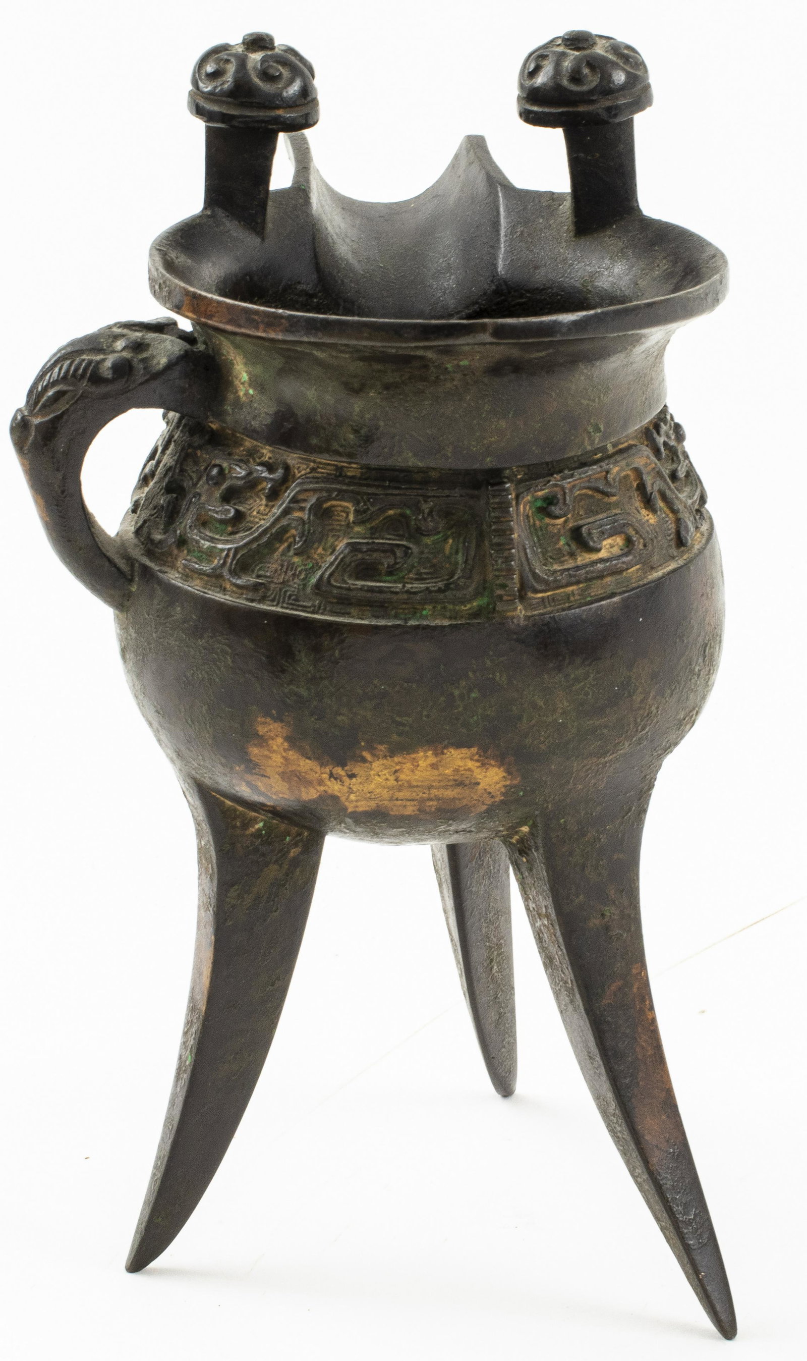 Ming Dynasty Bronze Jue Ritual Wine Vessel: Chinese Ming Dynasty (1368-1644) bronze Jue libation cup ritual wine vessel, tripod vessel with twin upright handles and arched handle at side, relief archaic lettering. 6.75" H x 4.75" L x 3.875" W.