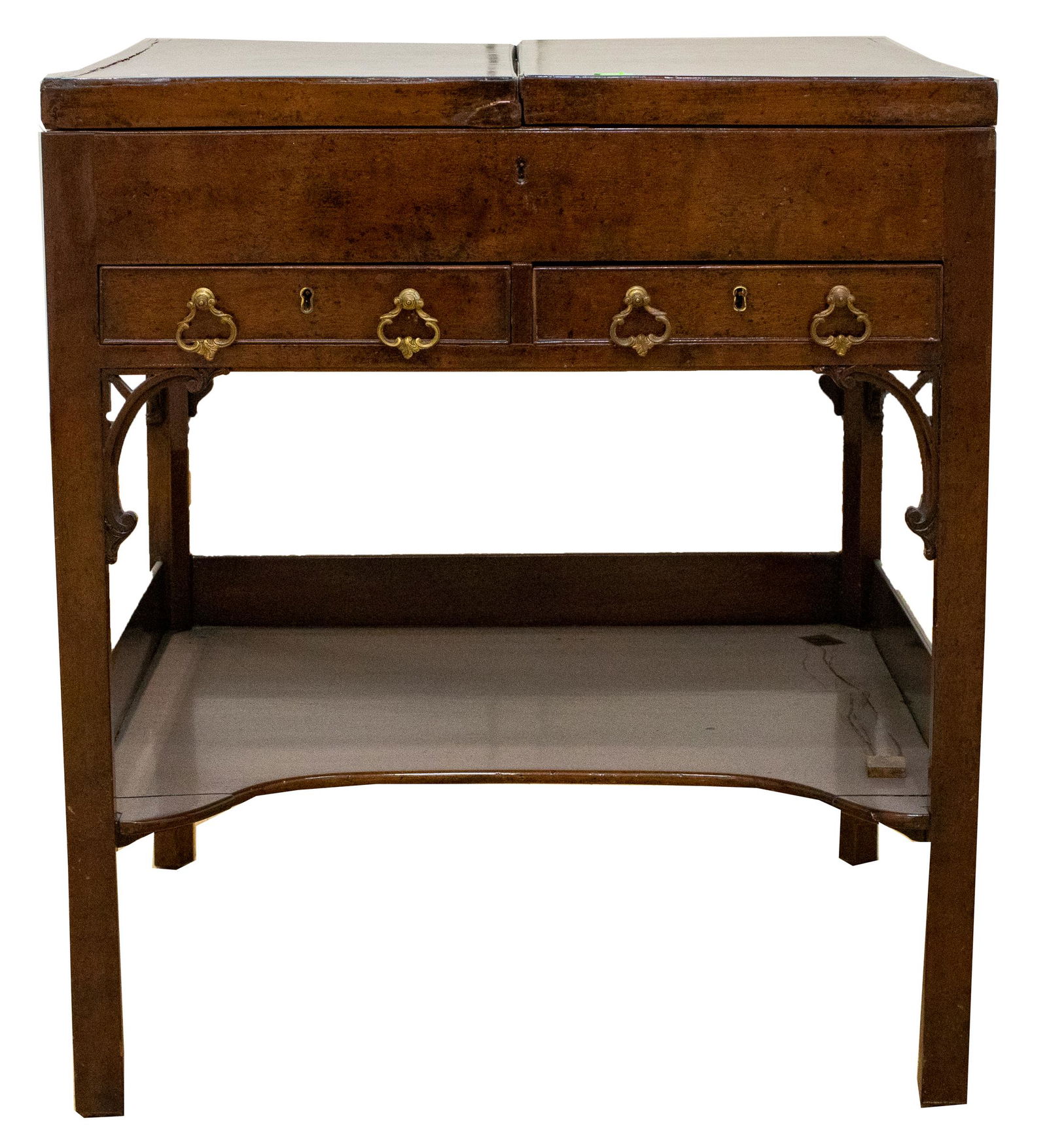 George III Style Mahogany Dressing Table: George III style mahogany dressing table, after a model by Thomas Chippendale (English, 1718–1779), the square hinged top opens to reveal a storage compartment, the front with pierced fretwork a