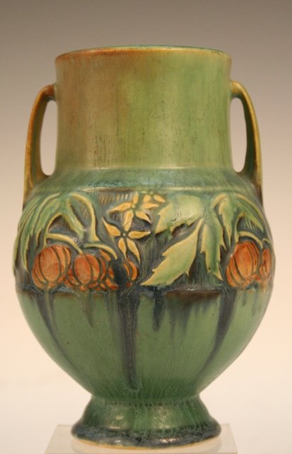 Roseville-Style Deco Amphora Ceramic Vase: Double-handled, Roseville-style amphora vase with a band of art deco design in low relief decorating the exterior wall of the body, ceramic; numbered on bottom 589. Dimensions: 6-1/4"H x 5"