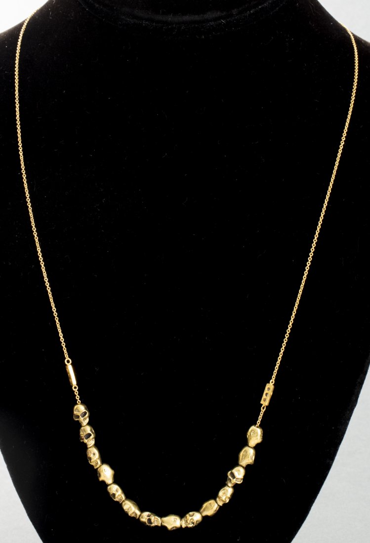 18K/14K Diamond Necklace W/ Gold-Tone Skull Beads: 18K and 14K yellow gold diamond necklace with fourteen gold-tone skull beads flanked with six rose-cut diamonds mounted on 18K yellow gold bar end. Diamonds approx: 0.06 cttw. Gold tested 18K and 14K.