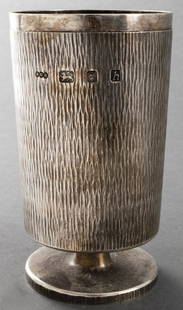 Adrian Gerald Benney English Silver Beaker: Adrian Gerald Benney English sterling silver footed beaker, hallmarked at side: "AGB / London / 1963." 5" H x 2.75" diameter. Approx: 10.90 ozt.