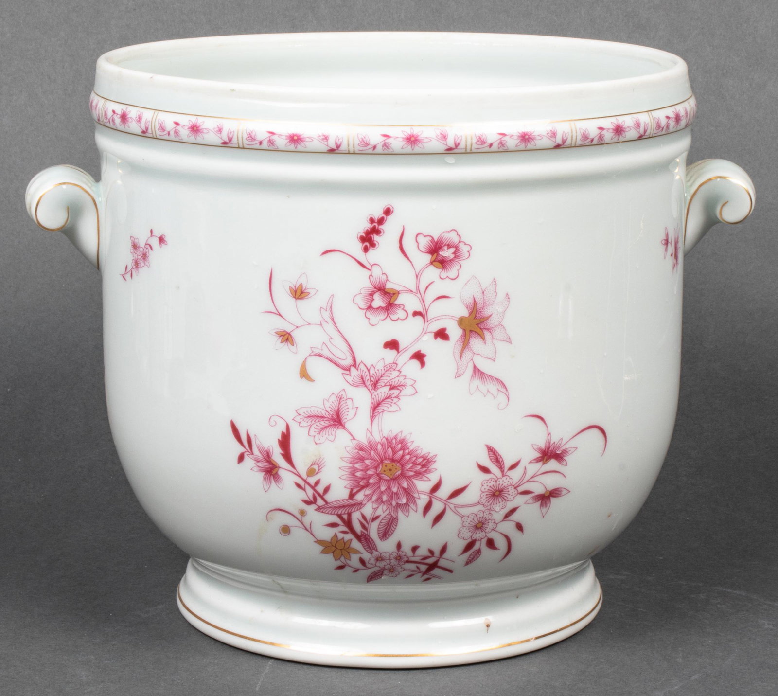 Limoges Painted Porcelain Champagne / Wine Cooler: Limoges paint and gilt decorated two-handled champagne/wine cooler with red floral details overall, base marked "Limoges France". 7” H x 9.5” diameter