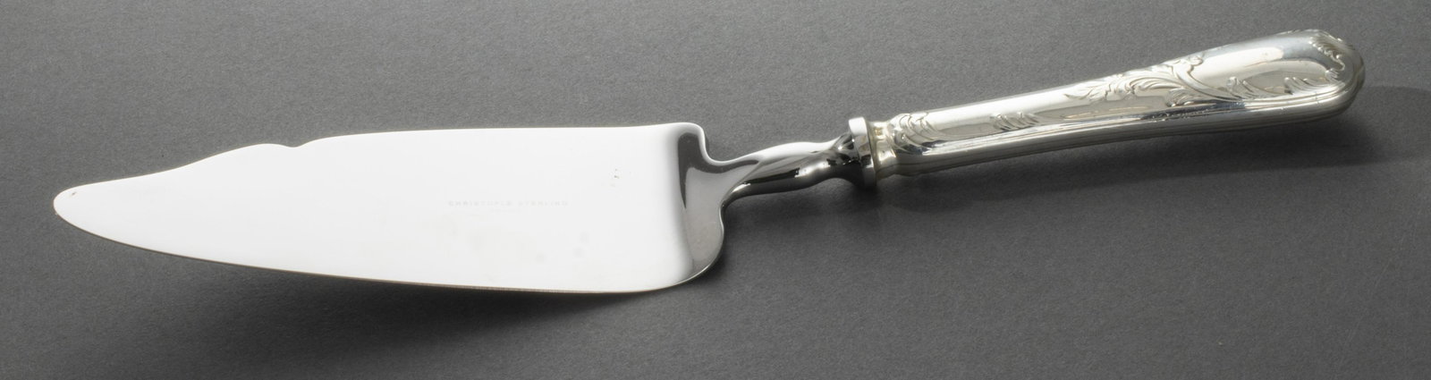Christofle Sterling Silver Serving Knife: Christofle sterling silver serving knife, with weighted handle marked: "925," blade marked: Christofle Sterling France. 10.75" L. Silver not weighable.