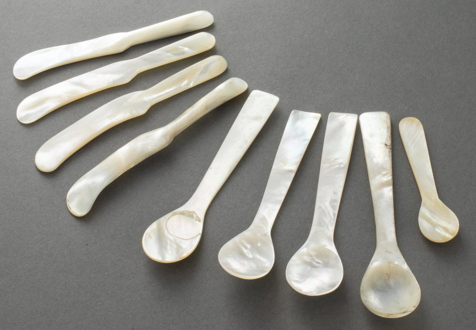 Mother of Pearl Caviar Utensils, Set of 9: Mother of pearl tableware, nine pieces, comprising caviar spoons and spreaders, with a box. Spreaders: 4.5" L.