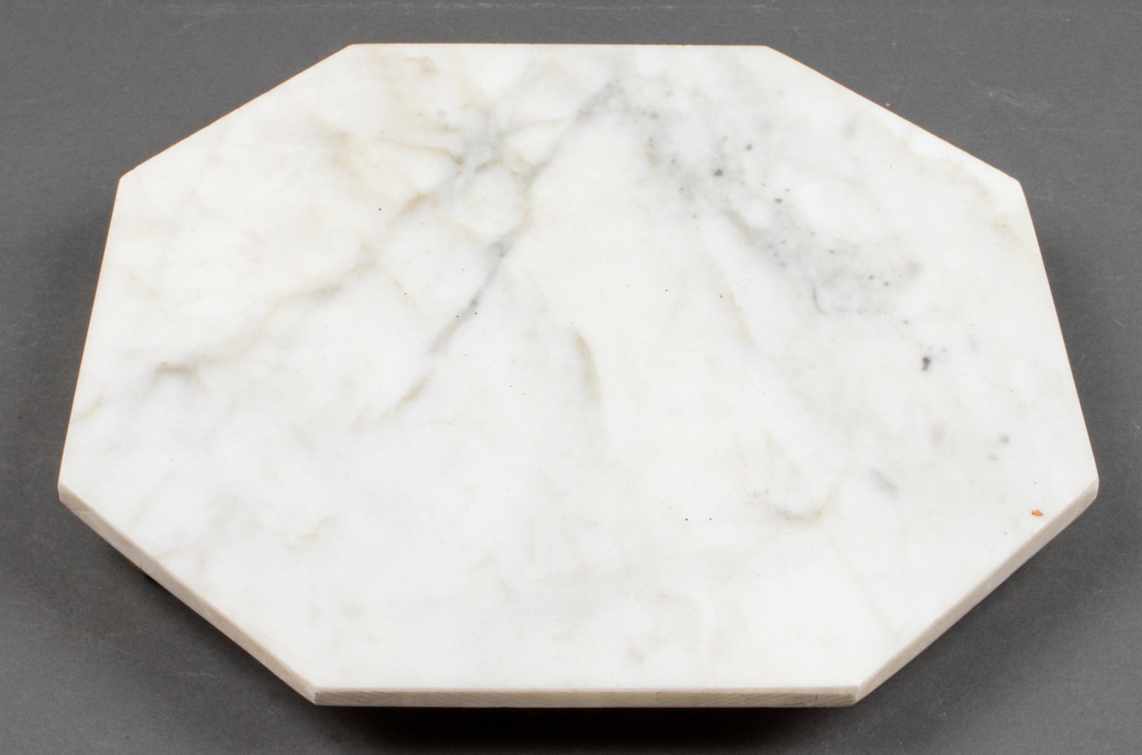 Italian Marble Octagon Trivet on Brass Feet: Italian marble octagon trivet raised on four brass feet. Stamped to underside. 1.5" H x 12" W x 12" D.