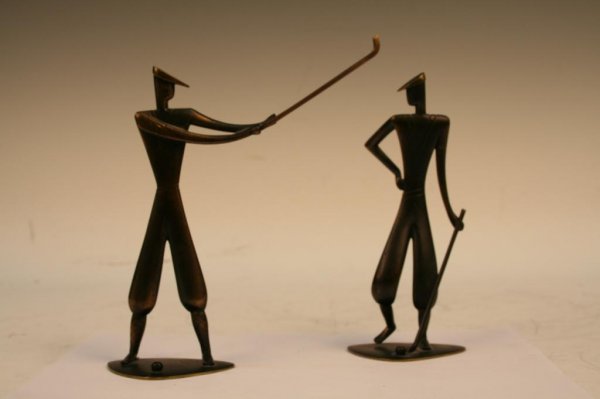 Set of Hagenauer Handmade Brass Golfer Sculptures: Set of two figural sculptures of men playing golf on triangular bases, one ready to swing a club and the other standing with a hand on his hip, by Franz Hagenauer (Austrian, 1906-1986), brass, Austria