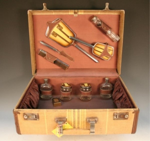 Deco Tweed Train Case w/9-pc Toiletry Set 1940s: Art Deco-style tweed train case features leather trim, original brass hardware, and banded interior side pockets, ca. 1940s, includes a nine-piece toiletry set consisting of a mirror, nail file, comb,