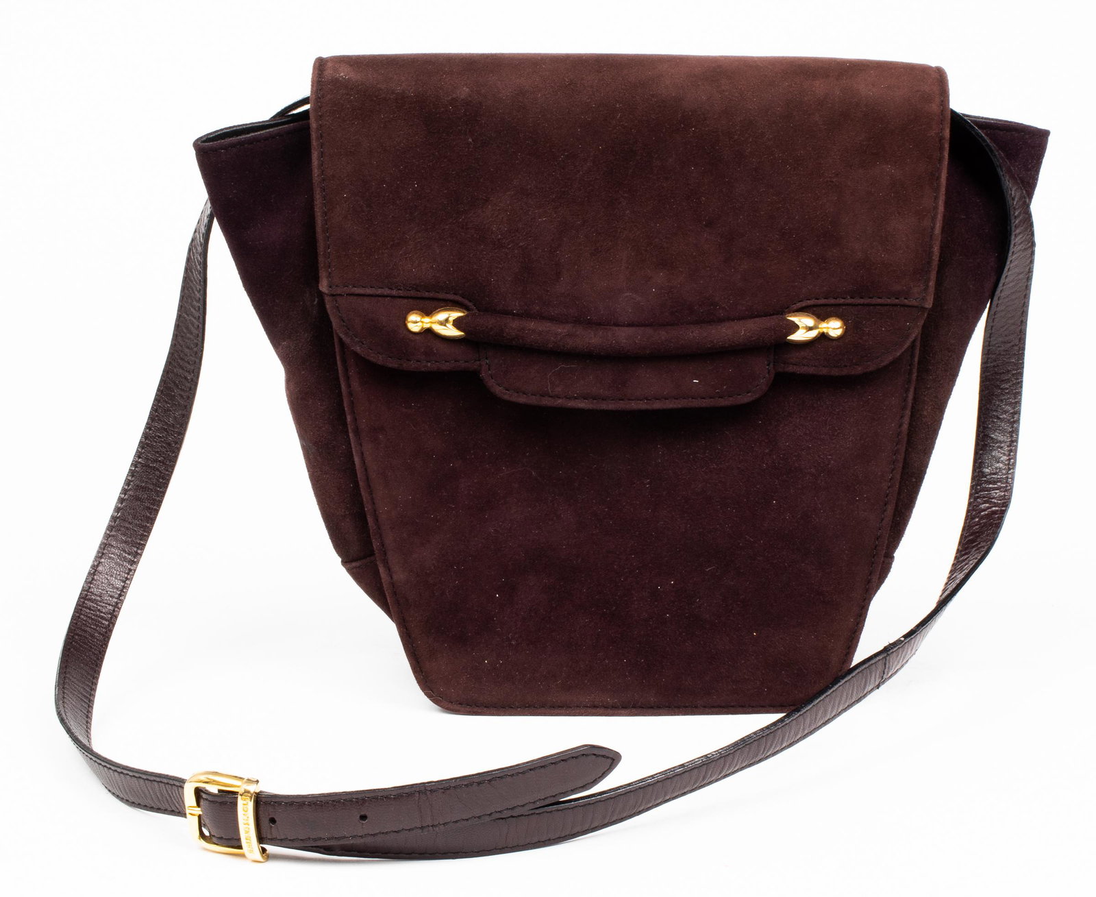 Bruno Magli Brown Velvet Handbag: Bruno Magli brown velvet handbag with leather trim and snap closure, gold-tone hardware, the interior with one pocket and stamped "Bruno Magli". 8” H x 7.75” W x 3” D. Provenance: From the estat