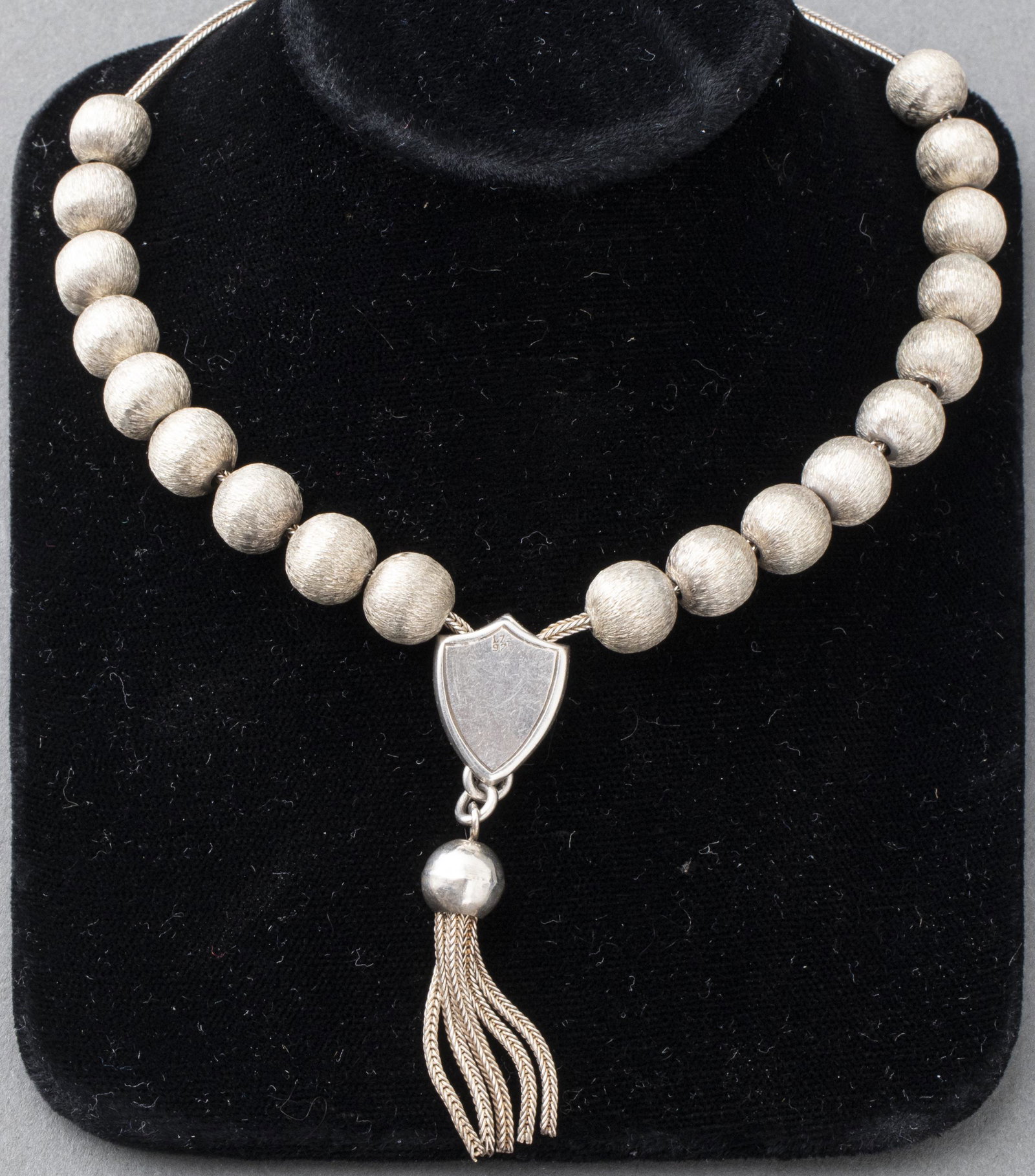 Vintage Sterling Silver Prayer Beads With Tassel: Vintage sterling silver prayer beads with tassel, comprise of nineteen approx 9 mm florentine finished silver beads on square wheat chain, converged into shield and drop tassel. Marked: " 1.73 / 925".