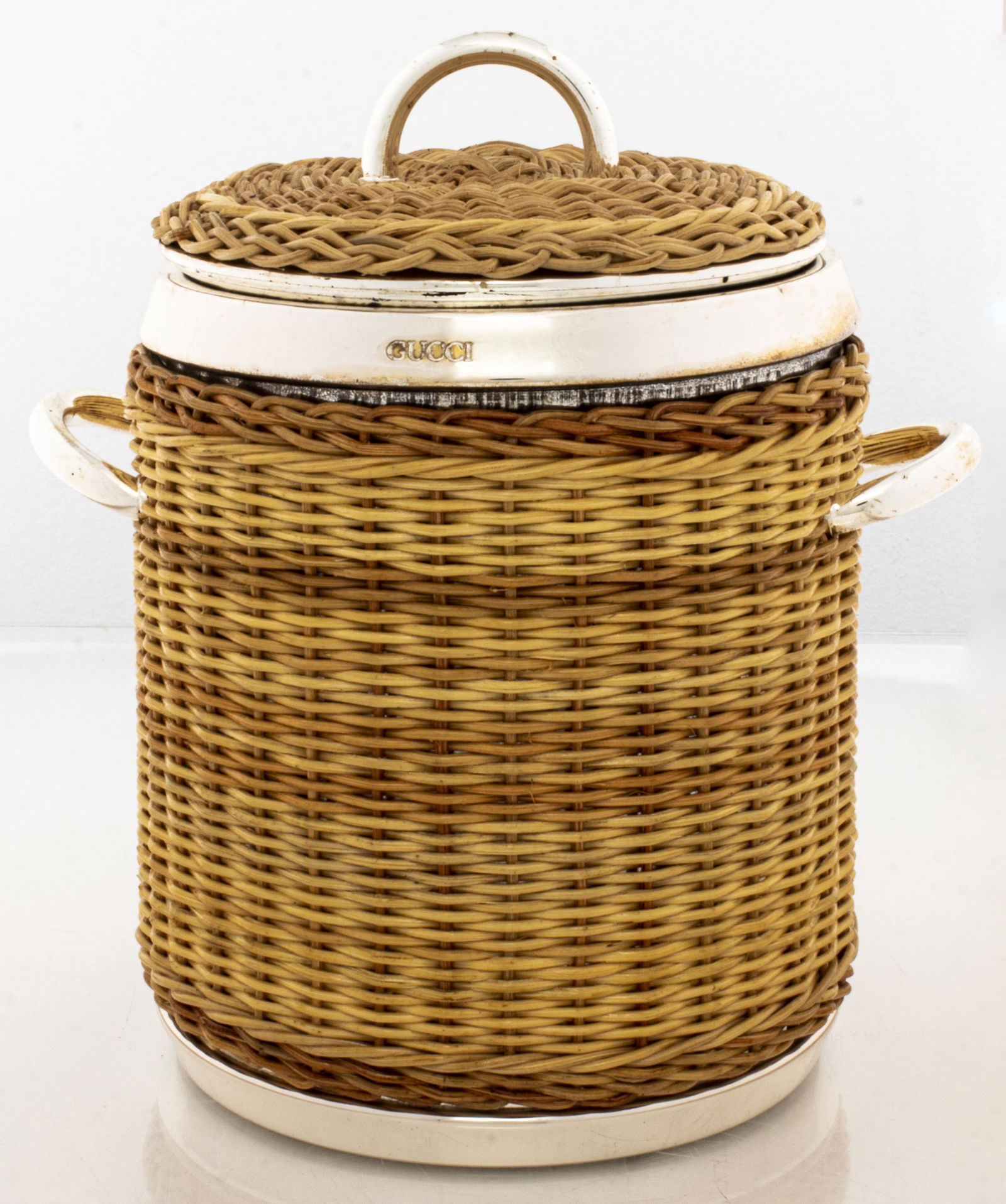 Gucci Modern Chrome & Wicker Ice Bucket: Gucci modern chrome and wicker / rattan ice bucket / wine cooler, signed to neck: "Gucci" and to underside: "Gucci Made in Italy" 9.25" H x 7.5" W (across handles).