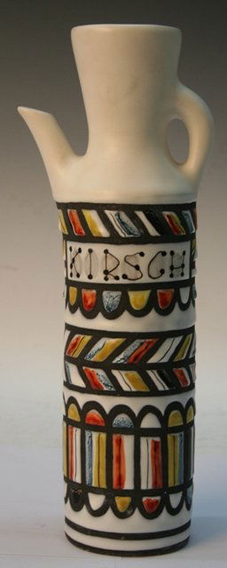 Ceramic Pitcher by Roger Capron 1950s French: White pitcher with a matte glaze, multicolored stripes, and Kirsch written on the body, by Roger Capron, ceramic, France, 1950s; marked CAPRON VALLAURIS on bottom.