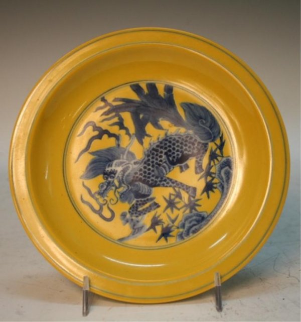 Chinese Yellow Ground Blue & White Plate: Yellow ground plate with blue and white dragon decoration, porcelain, China; marked on bottom. Dimensions: 1"H x 7-3/8" diameter