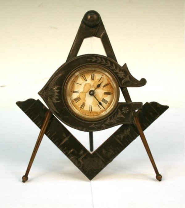 Ansonia Compass Desk Clock American 1920s: Desk clock with motifs of compasses and a right-angle ruler, manufactured by the Ansonia Clock, New York, United States of America, 1920s; marked "PAT. APRIL 23D 1878" on reverse. Dimensions: 7"H x 5-