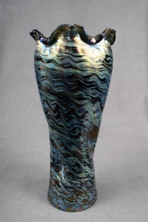 Loetz Rindskopf Austrian Vase ca. 1900: Loetz Rindskopf vase featuring layered blue glass flowing upward diagonally right-to-left that opens to a wide, free-form curvilinear mouth, Austria, ca. 1900. Dimensions: 13-1/2"H x 5-3/4" diameter