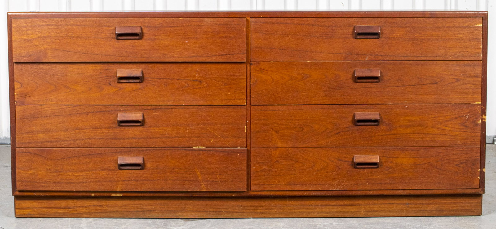 Mid-Century Modern Teak Chest Of Drawers: Mid-Century Modern teak chest of eight drawers, the credenza cabinet in the Danish taste. 26” H x 59” W x 18.5” D.
