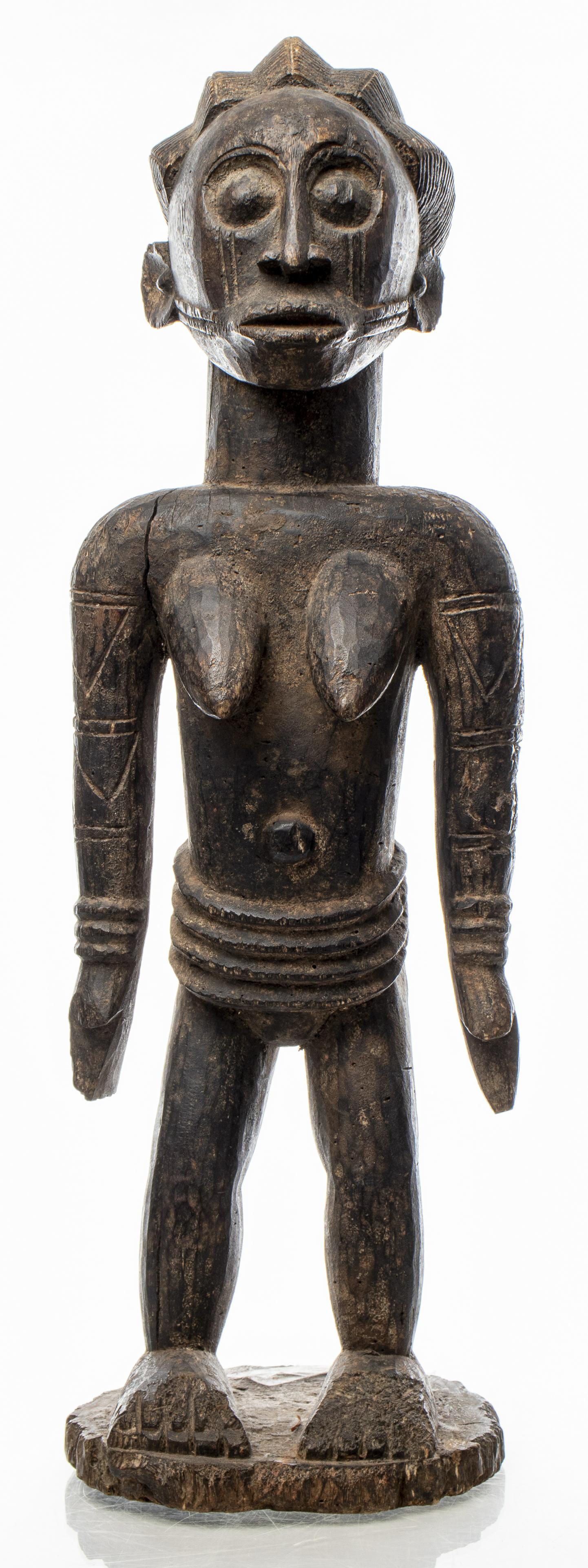 African Eloyi Carved Figure, Nigeria: Eloyi (Afo) people, carved wood figure, 20th century, Nigeria, depicting a tall female figure with scattered incised designs to face and arms. 25.5" H x 8" W x 6.5" D. Some cracks and chip losses to w