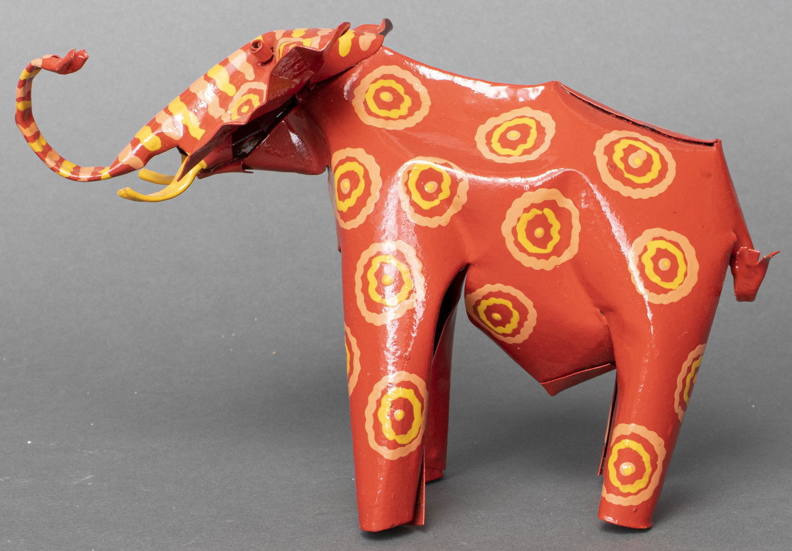 African Folk Art Painted Tin Elephant Sculpture: Folk Art painted tin sculpture of an elephant, made in Zimbabwe. 6" H x 8.5" W.