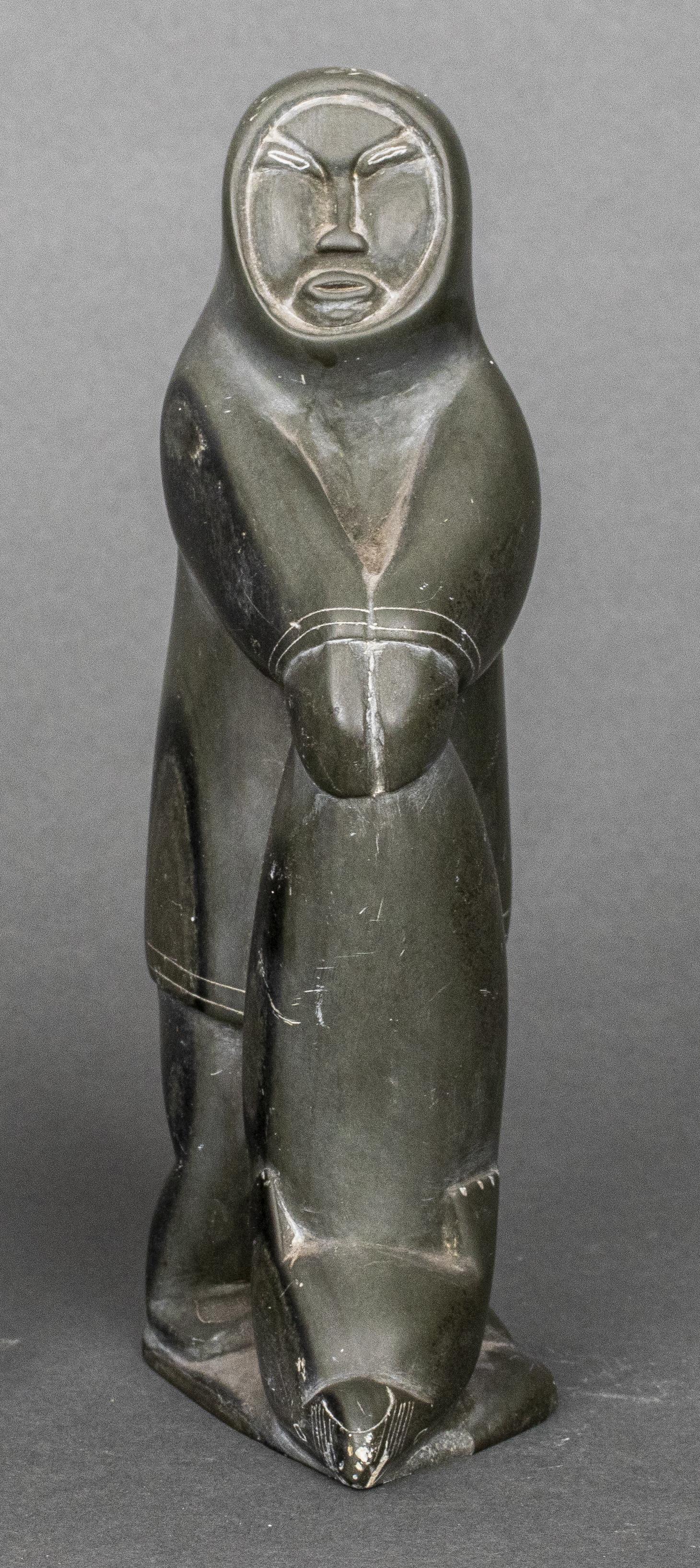 Native Alaskan Figurine Yup'ik: Native Alaskan Inuit Eskimo (Yup'ik) figurine, hand carved, possibly from soapstone. 6.5" H x 1.75" W x 3.5" D.