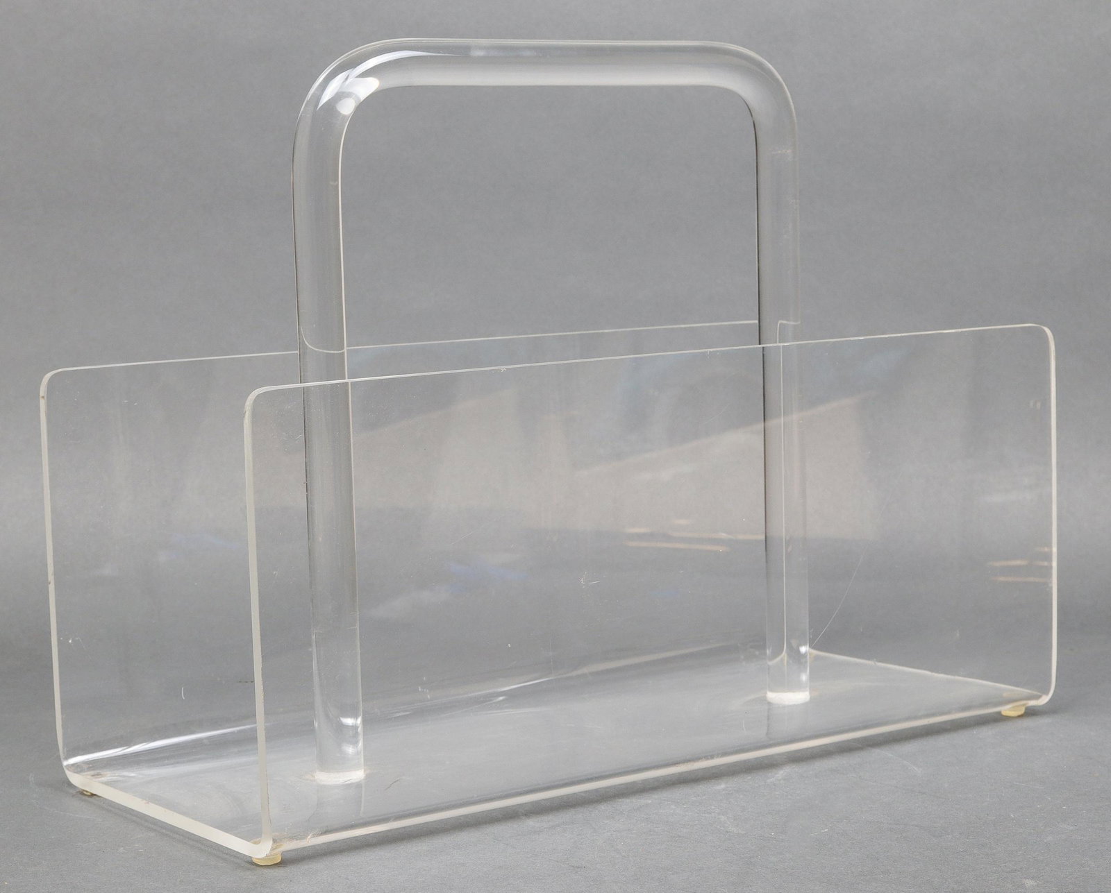 Modern Lucite Magazine Rack: Modern Lucite magazine rack / holder with central handle. 11.5" H x 16" W x 7" D.