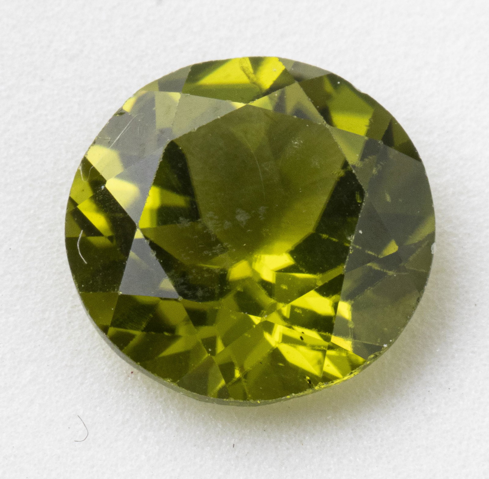 3.70 Ct. Loose Round-Cut Peridot Stone: 3.70 Carat loose round-cut faceted Peridot stone. Approx: 9.8 mm