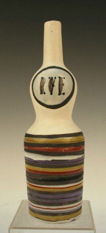 French Ceramic "Rye" Bottle by Roger Capron 1950: White bottle with matte glaze, polychrome stripes, and "Rye" written on body, by Roger Capron, ceramic, France, ca. 1950; marked "CAPRON VALLAURIS" on bottom. Dimensions: 12"H x 3-1/4" diameter