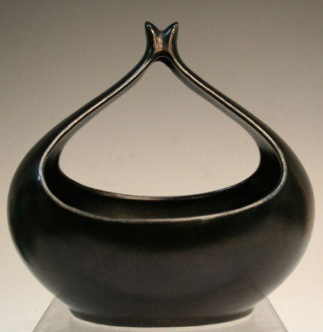 Eva Zeisel Black Ceramic Vase: Abstract vase with matte black glaze, by Eva Zeisel, ceramic, America, twentieth century; unmarked. Dimensions: 6-1/2"H x 6-1/2" diameter
