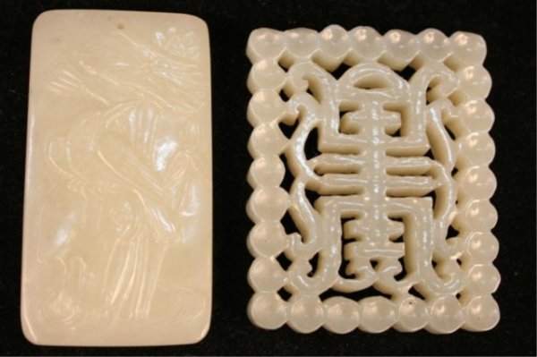 Set of 2 Chinese Hand-Carved Jade Pendants 20th C: Set of two hand-carved rectangular pendants, one decorated with an incised design showing a bird on a branch with flowers, the other with a pierced motif; each pierced for suspending from a string or 