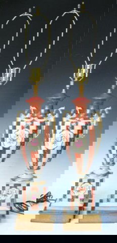 Pair of Hand-Painted Neoclassical Porcelain Lamps: Pair of hand-painted, Neoclassical-style lamps with tiered bases, two handles and gilded foliate decoration with floral motifs on the body of the lamps and bases, porcelain with brass harps; unmarked.