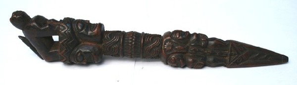 Nepalese Wooden Shaman's Dagger with Figures: Carved shaman's ritual dagger, traditionally used to heal and protect against harm, with stylized figures, wood, Nepal; unmarked. Dimensions: 11-1/2"L x 2" diameter