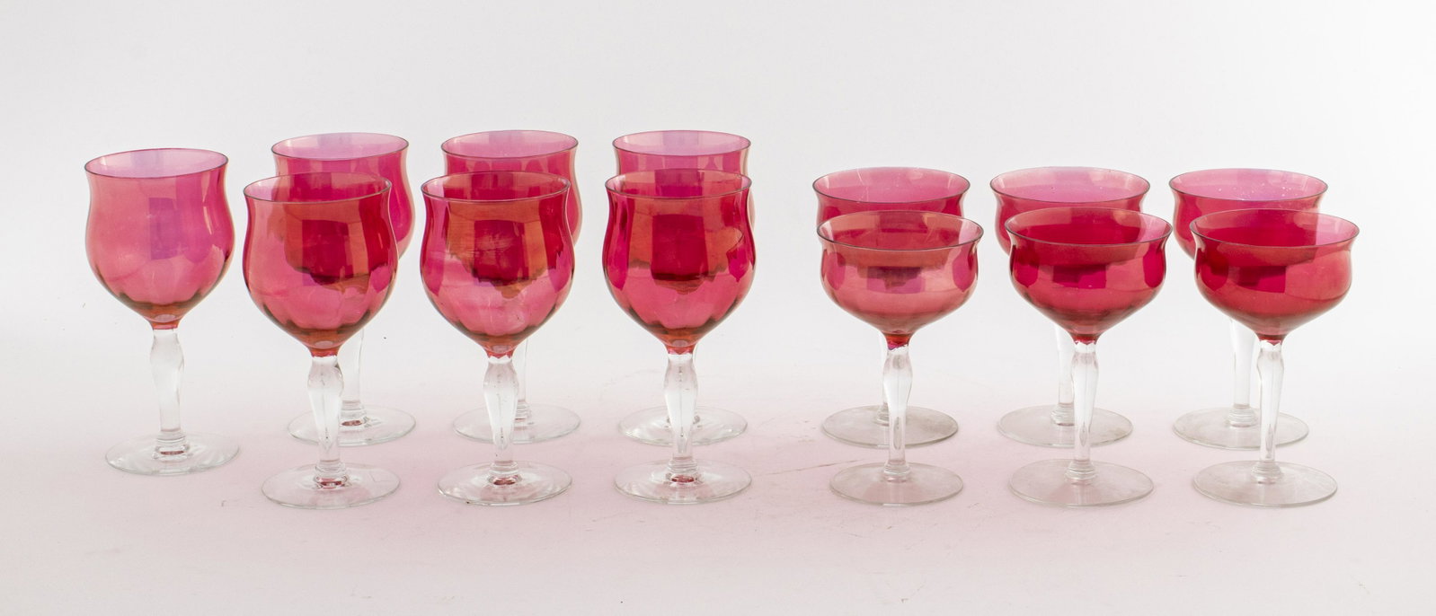Art Deco Cranberry Glass Stemware, 13: Art Deco cranberry glass stemware set, seven wine glasses and six champagne glasses. 6.5" H x 3.5" Diameter