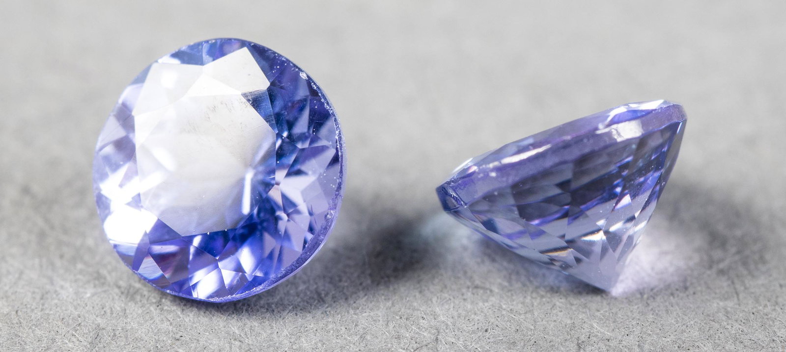 1.60 Cttw. Loose Round-Cut Tanzanite Stones Pair: 1.60 cttw. pair of loose round-cut faceted tanzanite stones. Stones measure 5.5 x 5.5 mm.