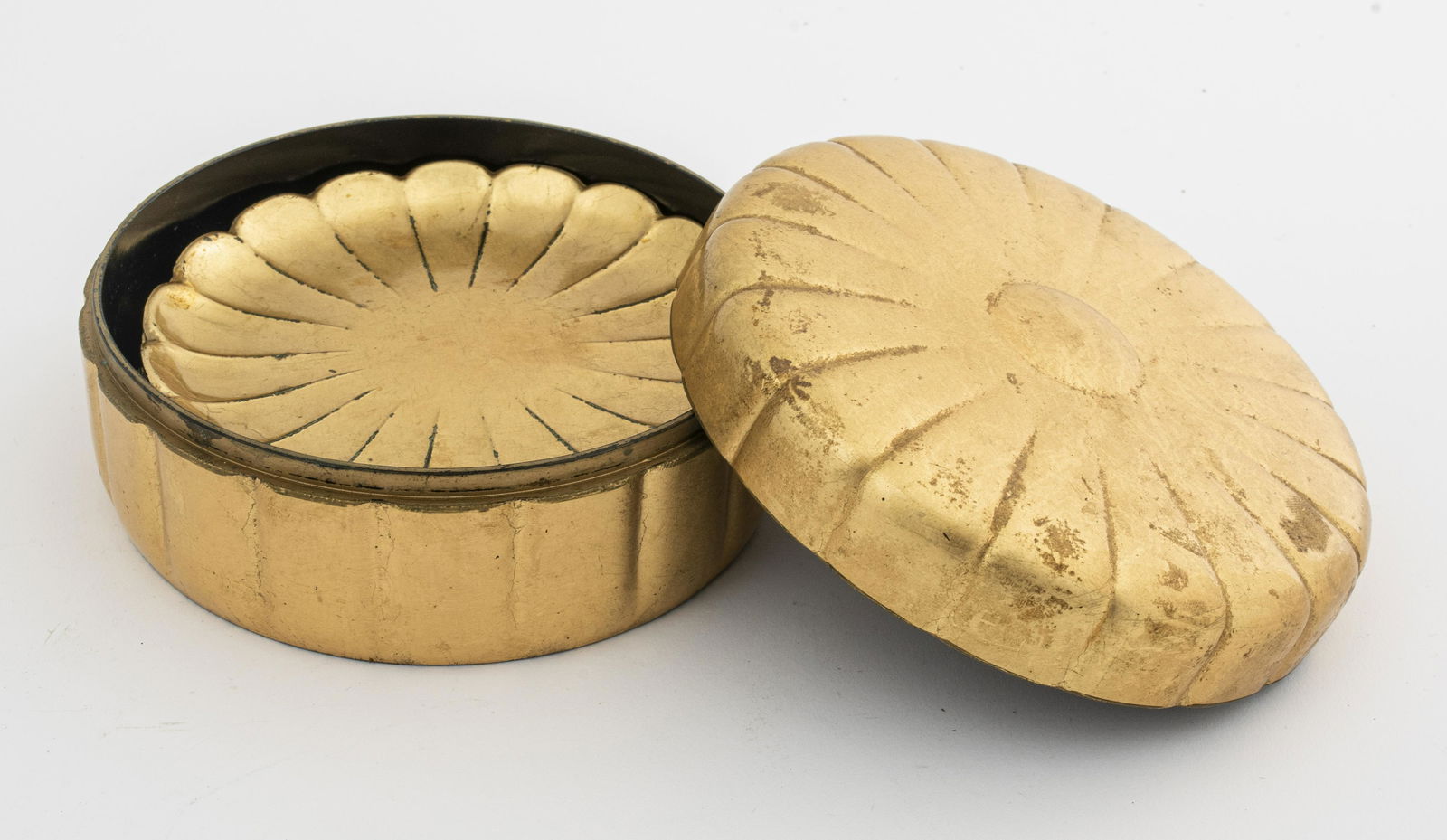 Japanese Gold-Toned Coasters with Case: Japanese gold-toned coasters with case, resin, marked "OMC / Japan / Patent." 4" diameter