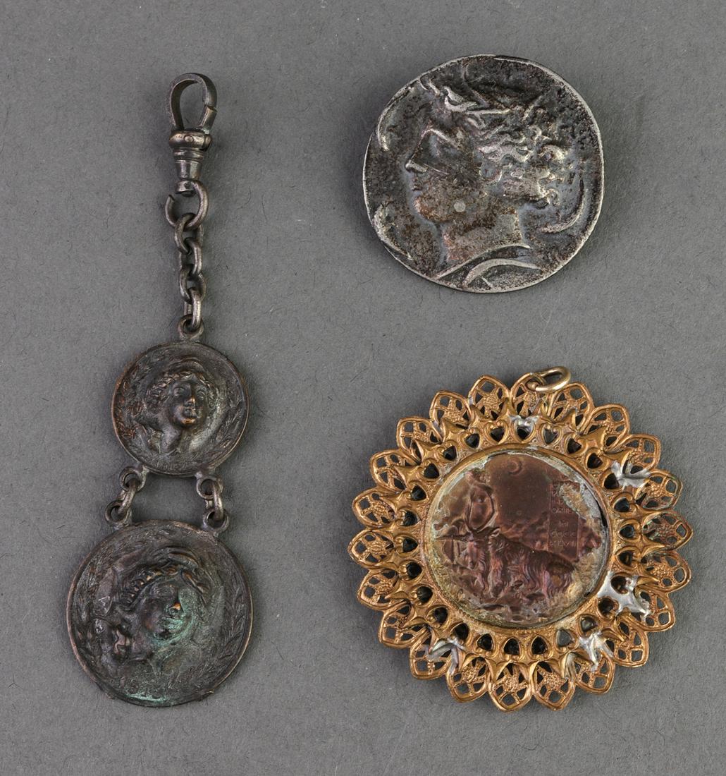 Misc. Turn of the Century Coin Jewelry, 3: Miscellaneous turn of the century group of three coin jewelry, including one tetradachm manner pin, a Cecilia Gonzaga Italian Renaissance manner coin set in filigree bezel pendant, and a double-coin t