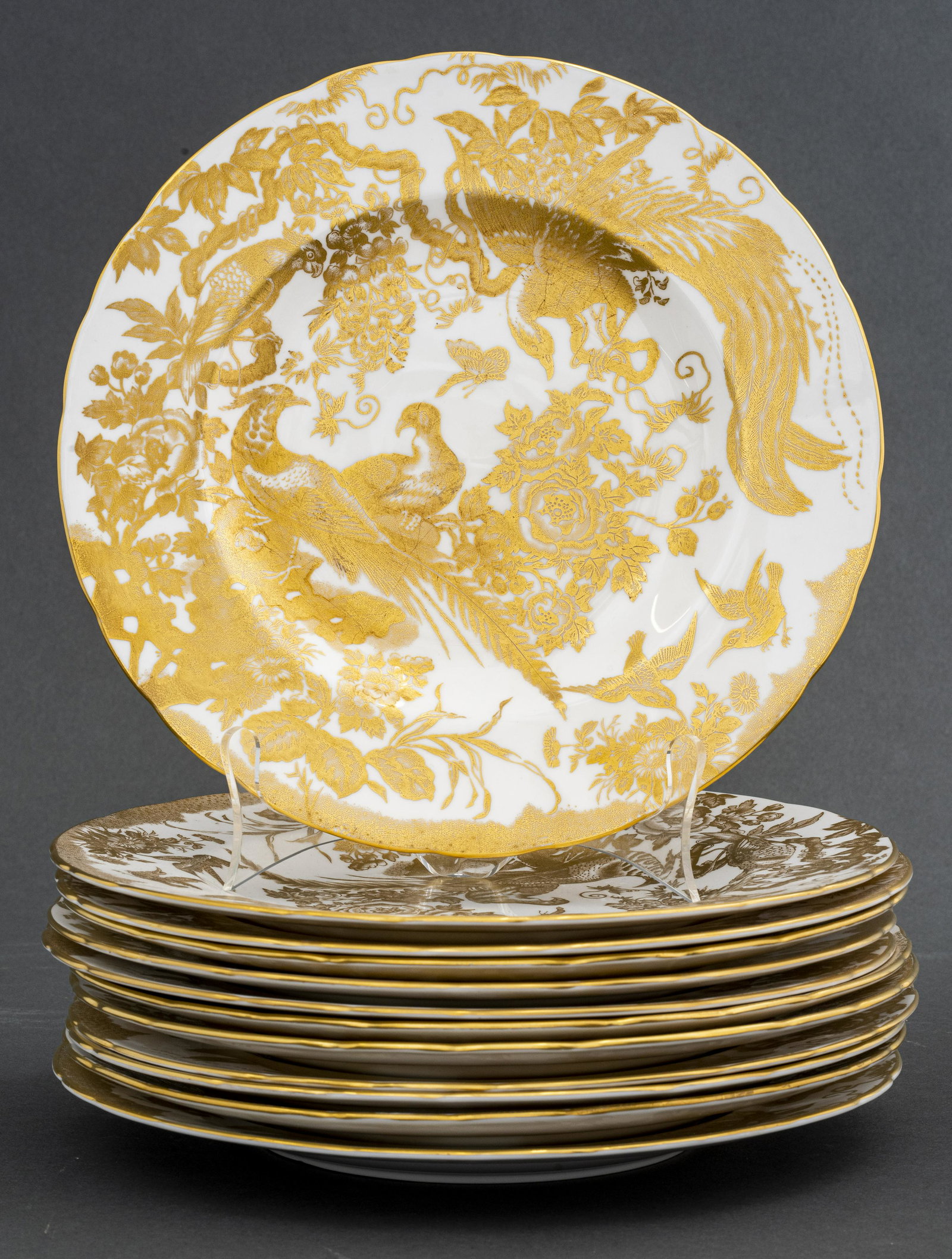 Royal Crown Derby Porcelain Gold 'Aves' Plates, 12: English Royal Crown Derby set of twelve porcelain bone china 'Aves' tableware dinner plates with gilt birds and floral motif, marked on bottom. 10.5" Diameter.